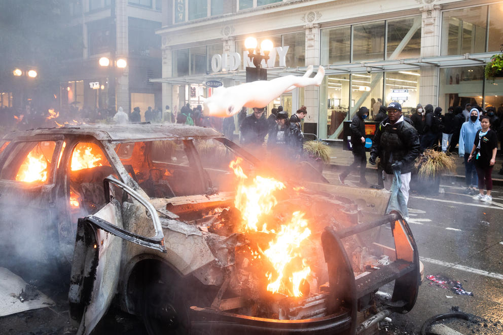 A car burns during the protest