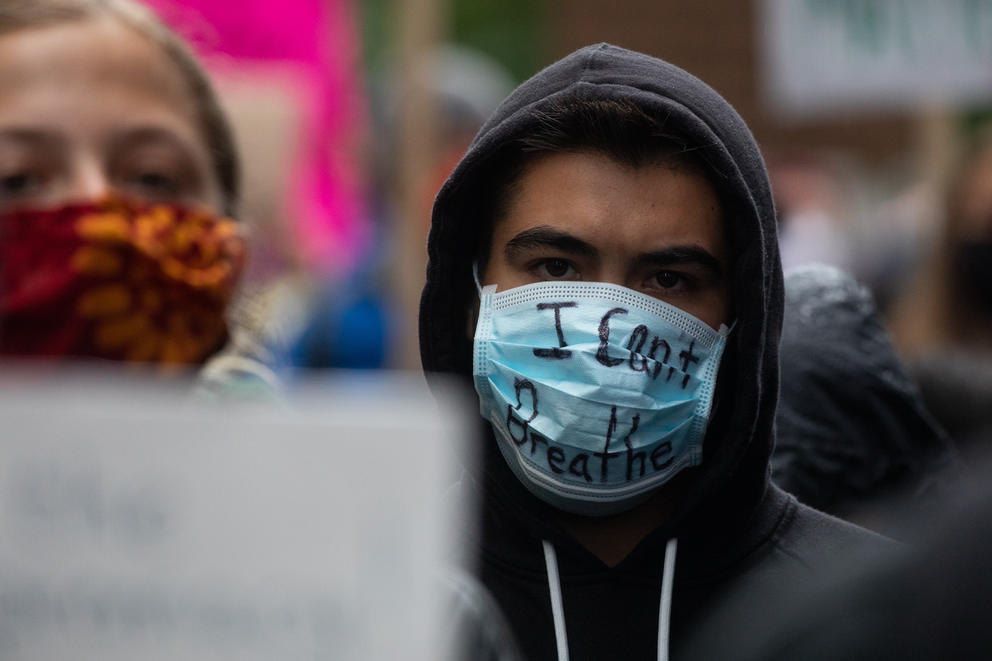 a protester wears a mask
