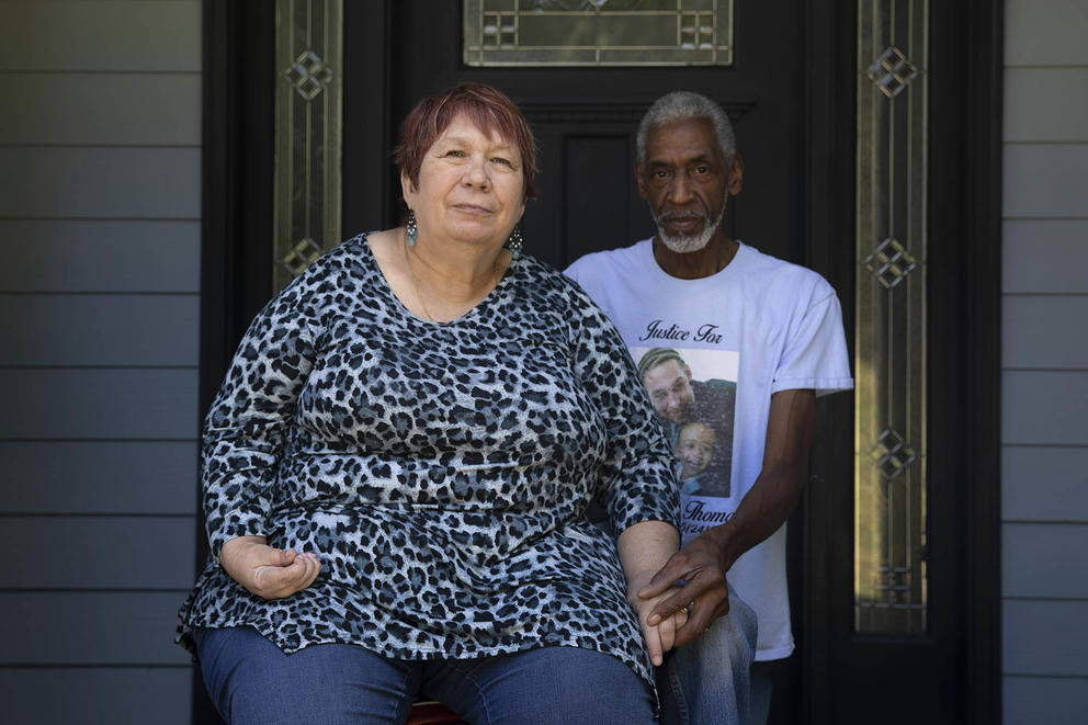 Annalesa and Fred Thomas stand at their door