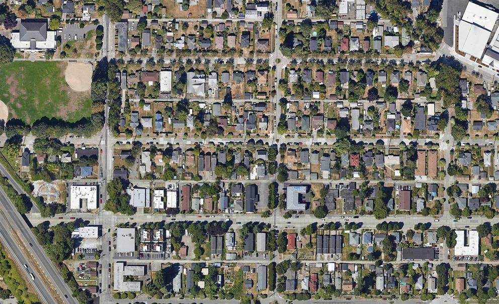 South Park from above revels a neighborhood with unkempt parks and many streets with few trees and vegetation. 