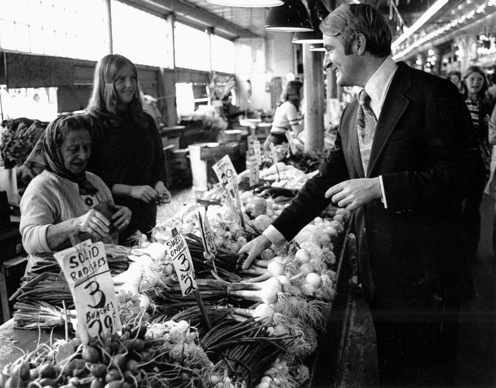 Black and white image of Mayor Wes Uhlman at Pike Place Market
