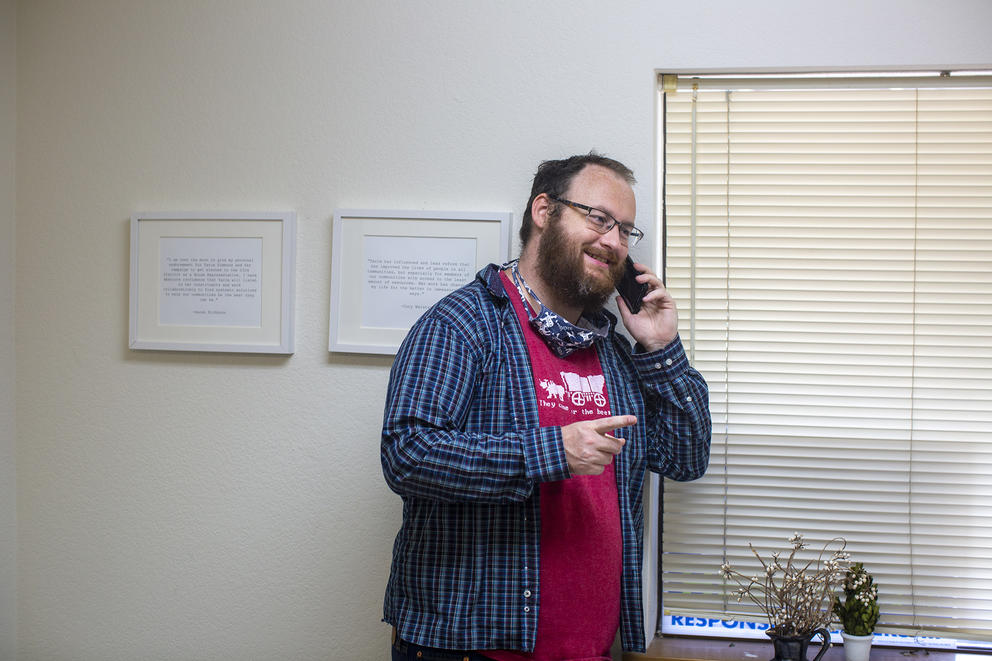 Jeff Beaulac talks on the phone in a campaign office 