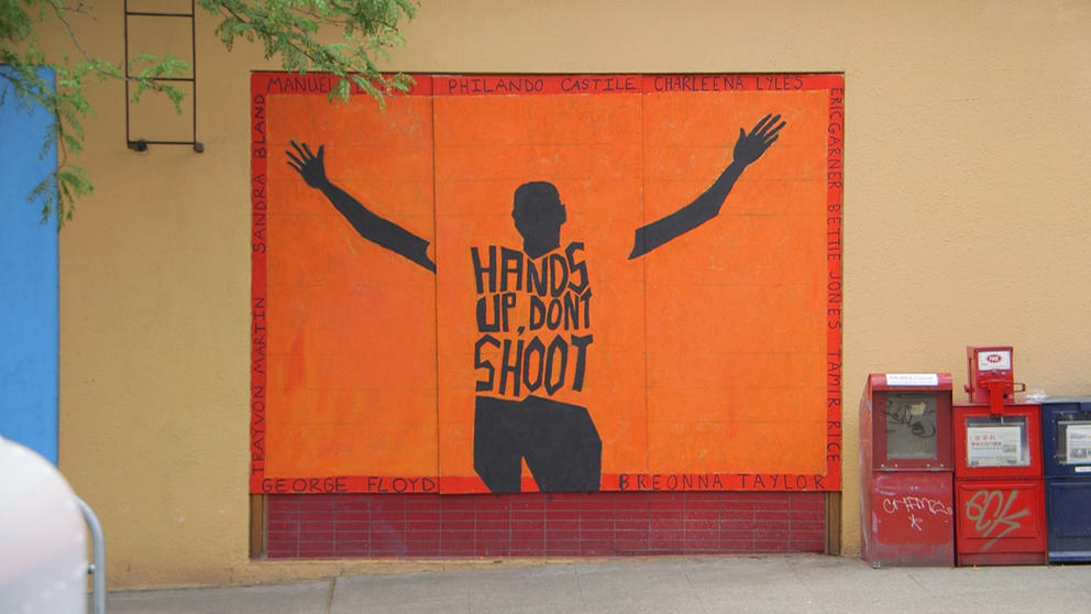 Mural with "Hands up don't shoot"
