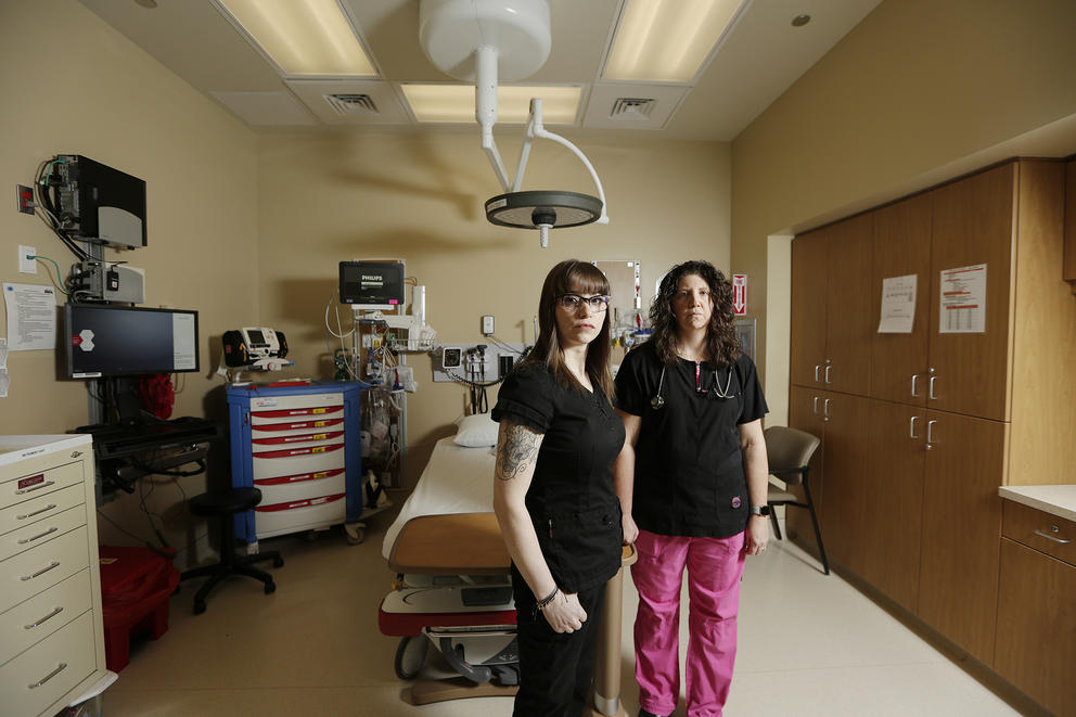 Two nurses stand in an examination room in Spokane