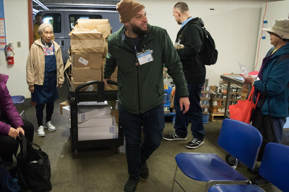 Milo, a driver for the Pike Market Food Bank arrives with goods he has picked up from various grocery stores in downtown Seattle, Jan. 15, 2019. (Photo by Matt M. McKnight/Crosscut)