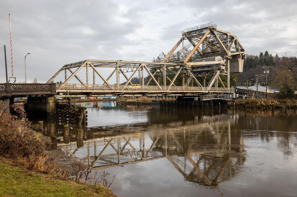 The Wishkah River Bridge reflects on the water in Aberdeen.