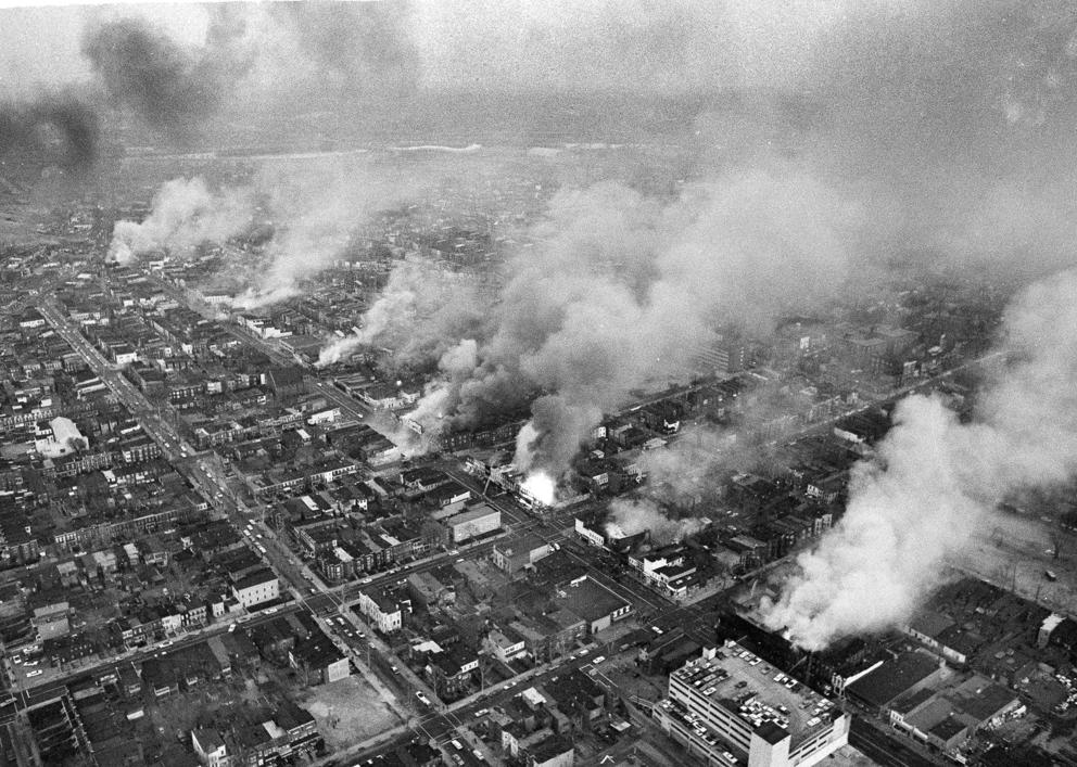 Aerial photo of buildings burning along a street