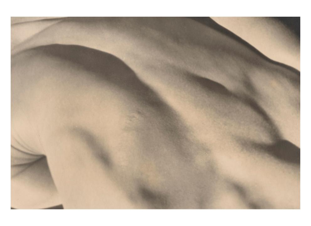 tightly cropped, close up photo of a nude back, looking almost like hills