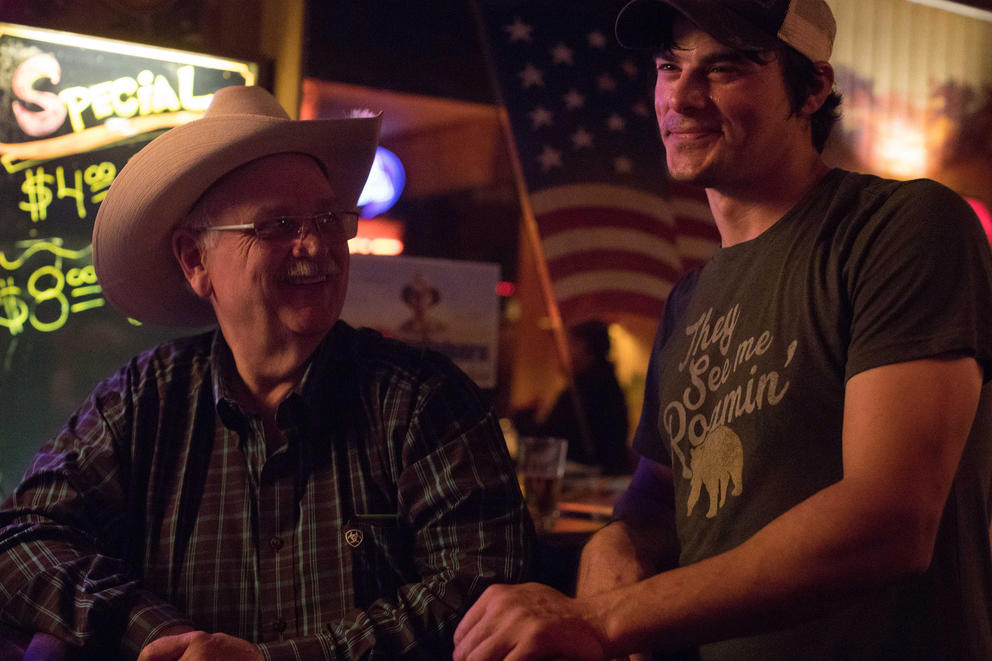 Jim Carden, a regular who has been visiting the bar for decades, visits with former bartender Jonathan Gubbe along the bar at Little Red Hen. 