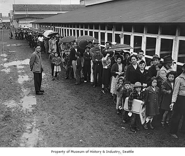 Adults and children stand in line