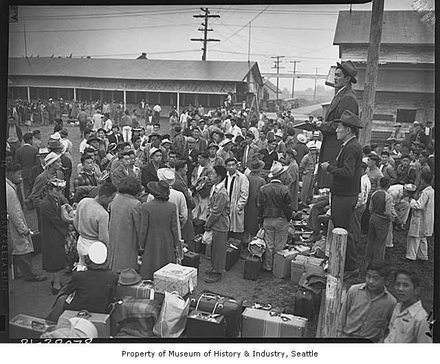 This 1942 photo shows a crowd of people preparing to leave the Puyallup Assembly Center