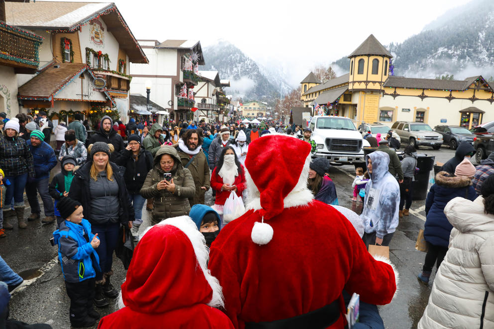 A crowd forms around Santa and Mrs. Claus in downtown Leavenworth