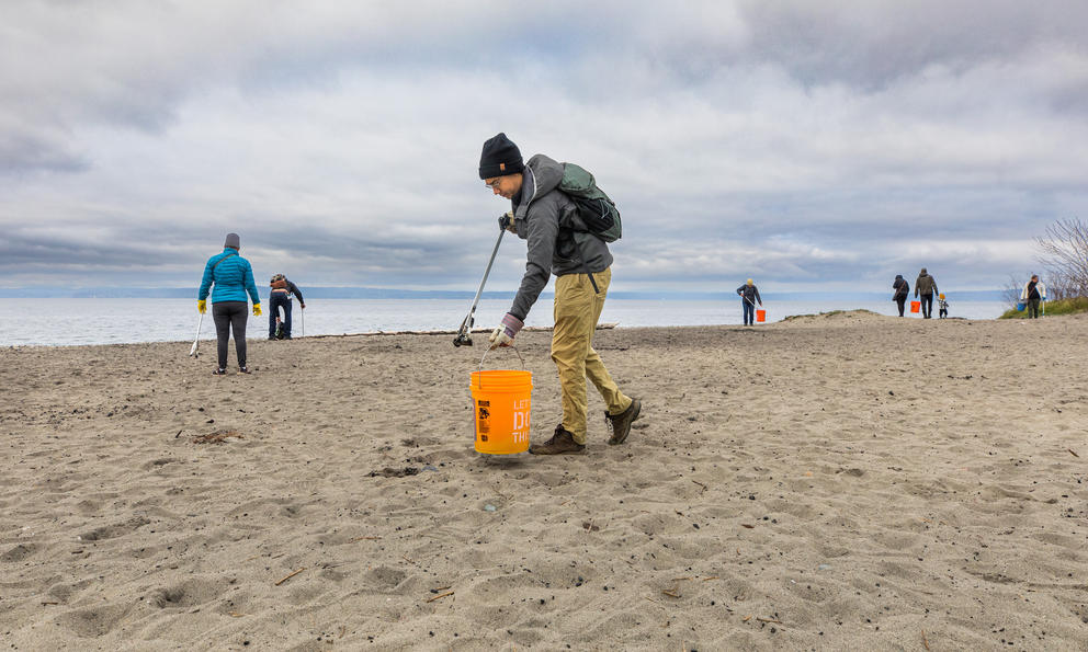 Volunteers collect marine trash at Golden Gardens Park in Seattle