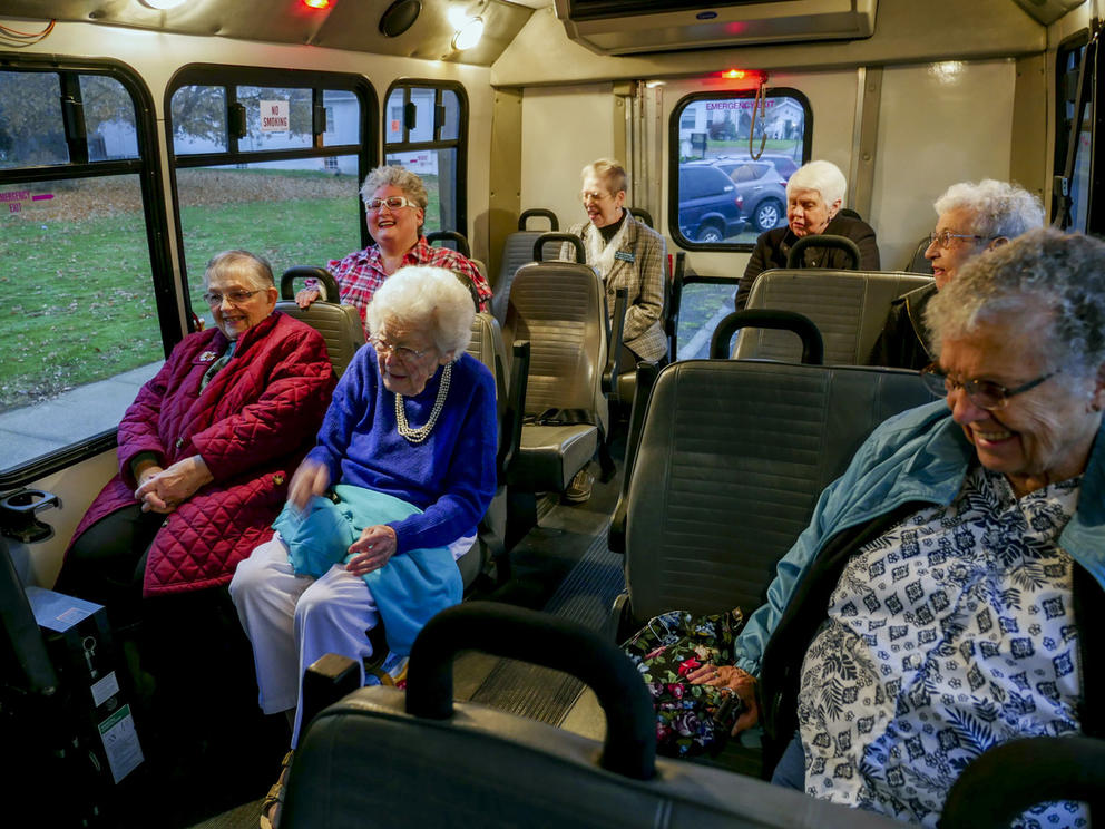 Elderly women sitting in a shuttle bus