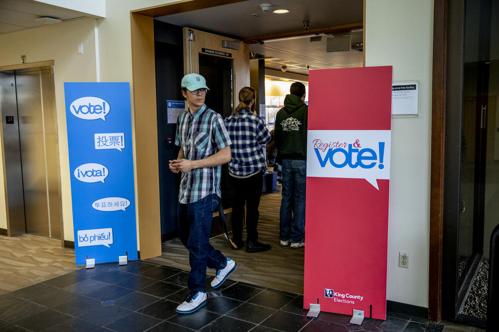 A person walks away from the customer service counter at King County Elections headquarters