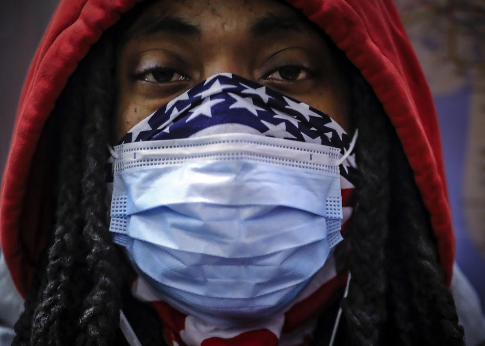 black man with american flag bandanna and surgical mask covering face