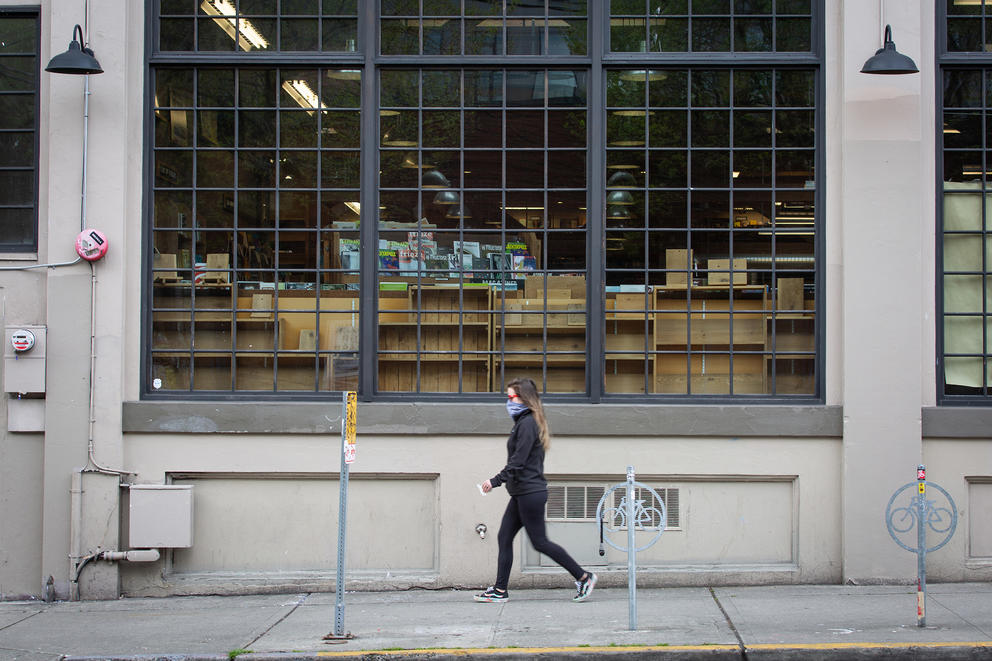 A pedestrian walks past a bookstore