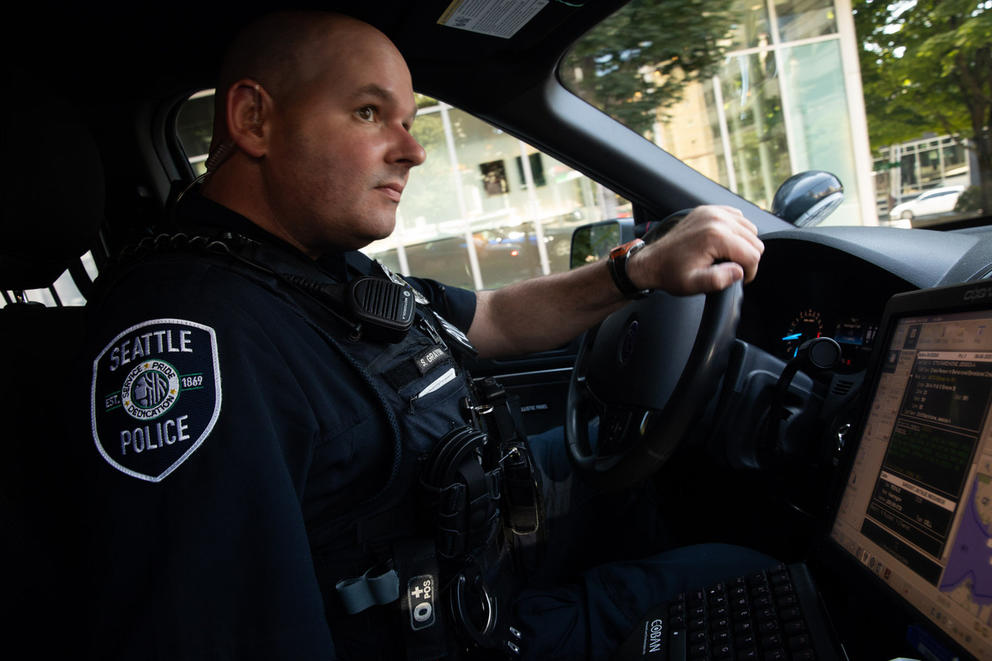 A seattle police office driving his car