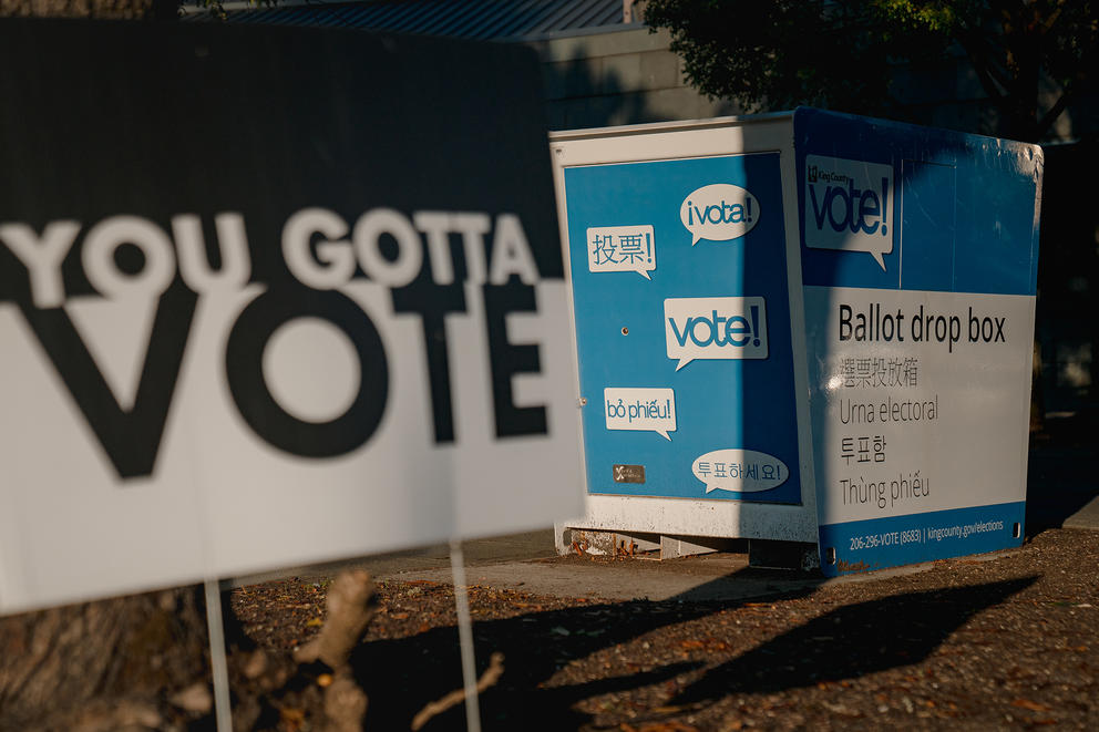 'You gotta vote' sign by a ballot box