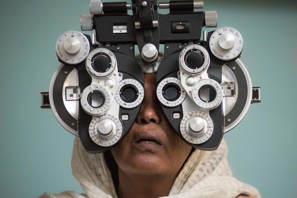 a patient takes an eye exam