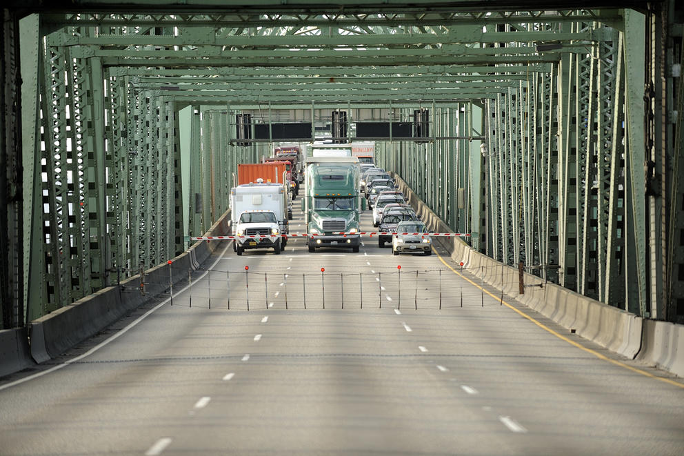 Trucks stopped on bridge