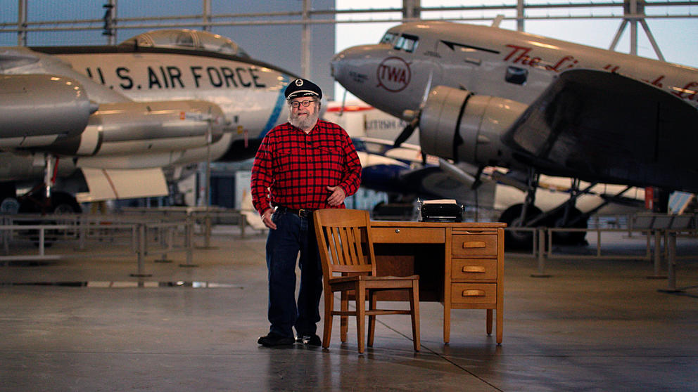 Knute Berger at a desk inside the Museum of Flight