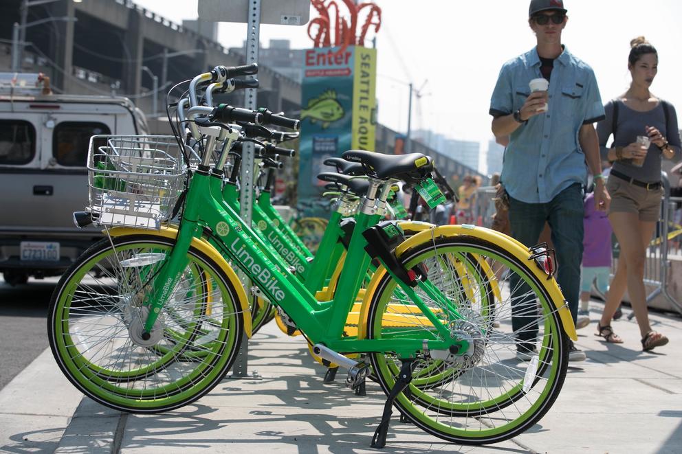 LimeBike bikeshare bicycles along Alaskan Way waterfront in downtown Seattle, Washington on Tuesday, August 8, 2017.