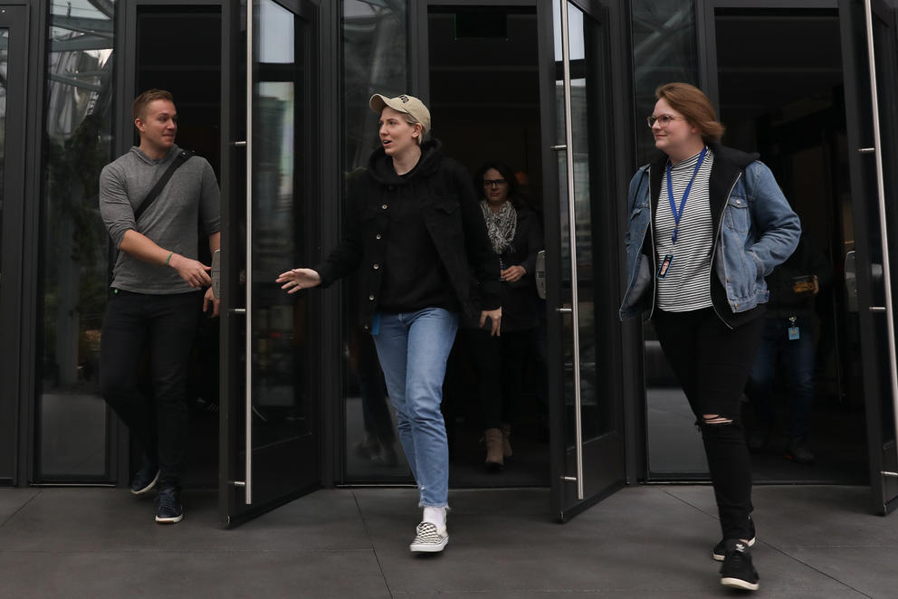 Amazon employees exiting a building