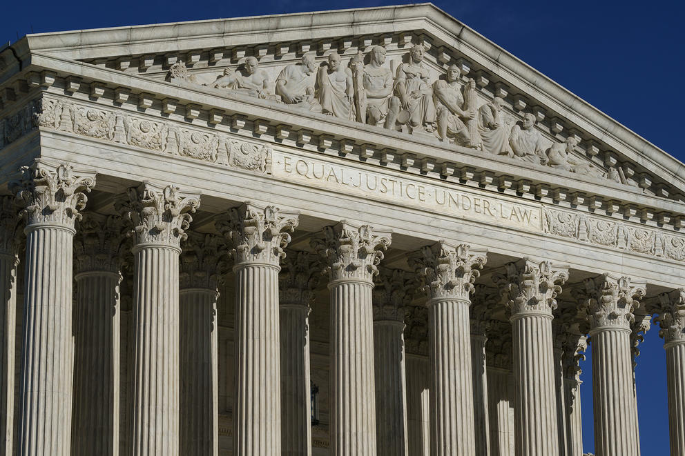 The columns and pediment of the U.S. Supreme Court are shown from an angle