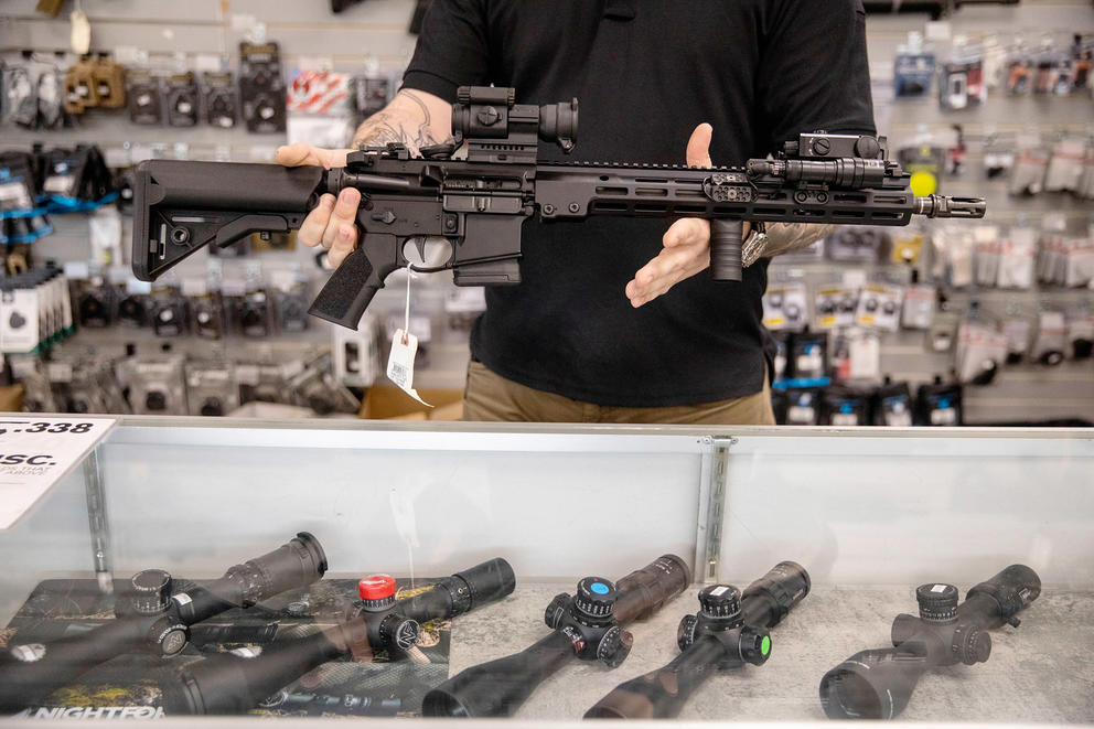 Photo of a rifle in a gun shop.