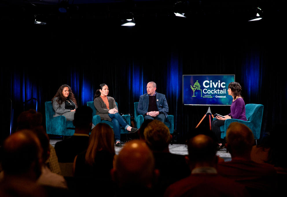 Three women and a man sitting on stage at Seattle' Civic Cocktail event