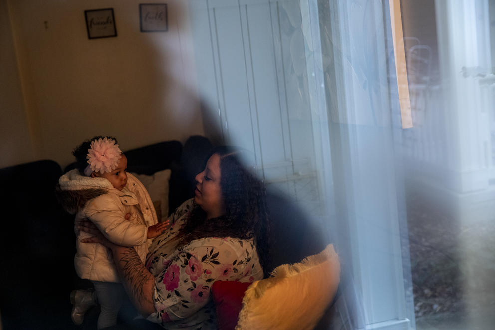Shavon Jones and her daughter, Promise, 18 months, in their Columbia City home on Feb. 18, 2021. After living in a two-bedroom apartment with her five children near Maple Valley because she couldn’t afford rent in Seattle, Jones was able to purchase her new home with help from Habitat for Humanity and Homestead Land Trust. With this new housing, she cut her commute from two hours to 20 minutes. (Dorothy Edwards/Crosscut) 