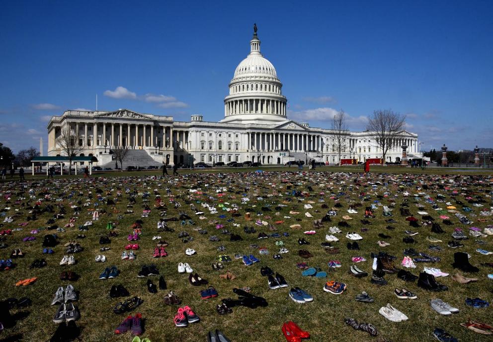 Thousands of children's shoes line the grounds of the Capitol building in D.C.