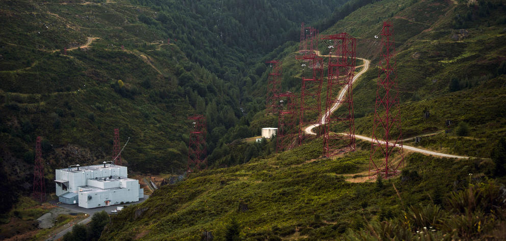 A radio transmitter and towers on a hillside