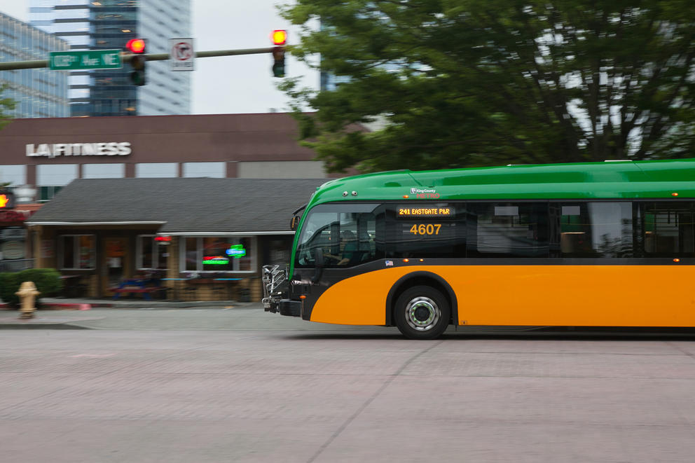 An electric bus drives down a street