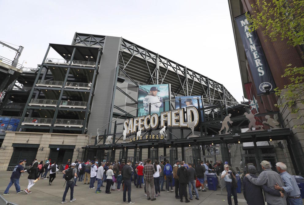 A crowd enters Safeco Field, the home stadium of the Seattle Mariners baseball club, on May 5, 2018. (Photo by Kyodo/via AP Images)