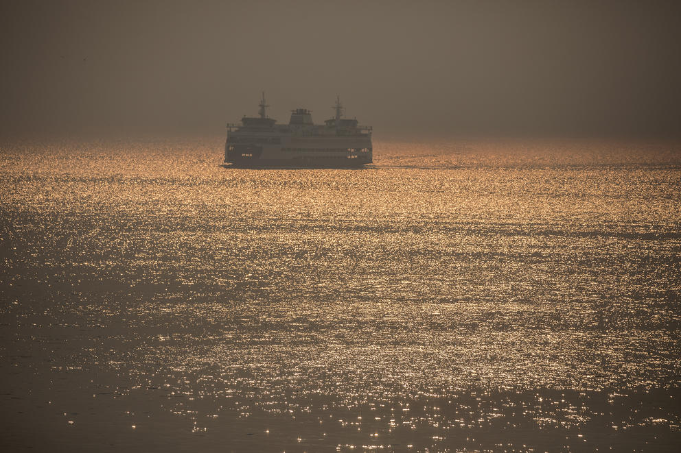 A Washington state ferry is seen traveling across Elliott Bay towards Seattle's waterfront amid a smoky haze, Aug. 21, 2018. (All photos by Matt M. McKnight/Crosscut) 