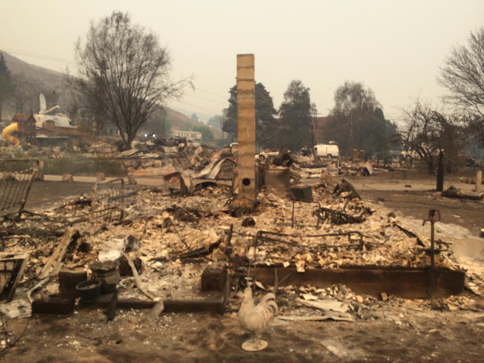 The burned remains of a neighborhood in Pateros. Only one home's chimney is still standing.