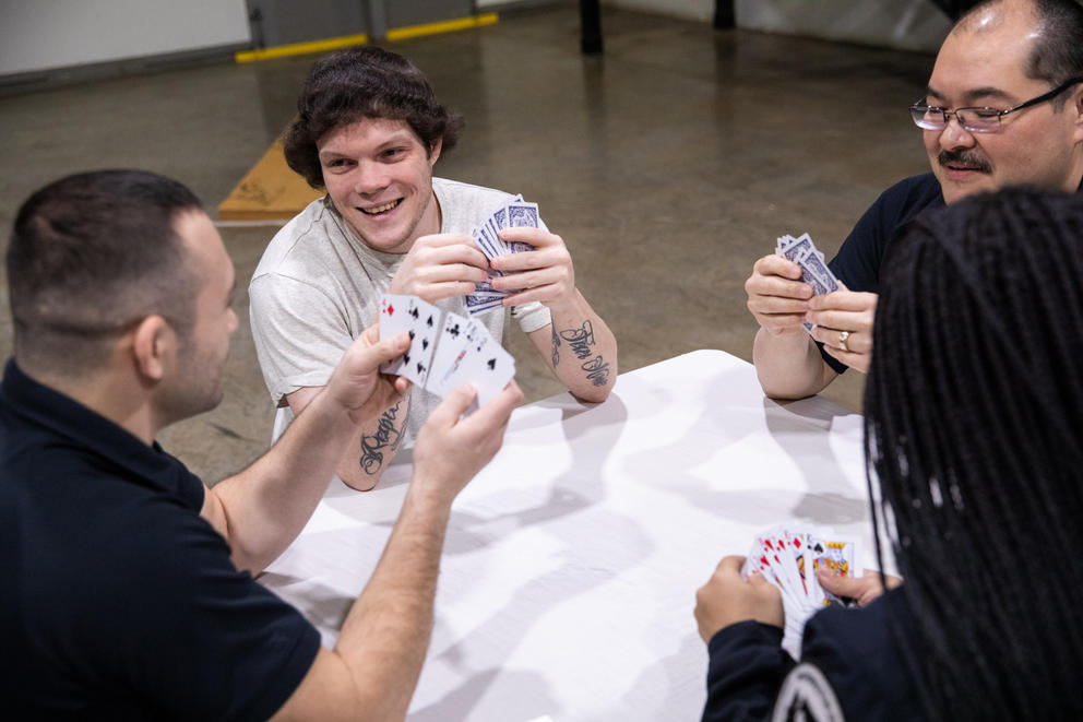 Shawn Crump plays cards with correctional officers 