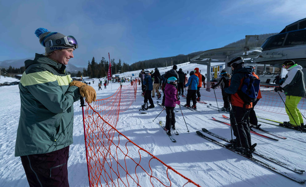 General manager Rikki Cooper keeps an eye on the Great White Express lift line at White Pass Ski Resort