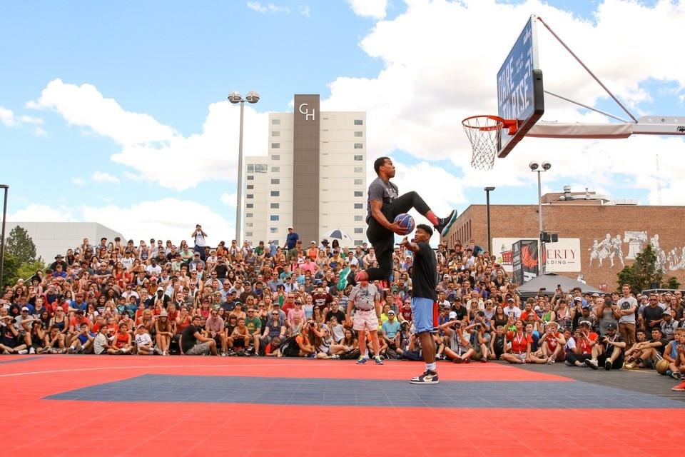 Man making a dunk with an audience watching