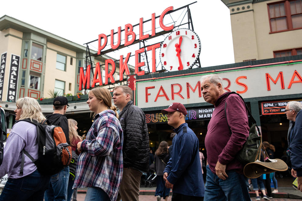 Visitors walking around Pike Place Market 