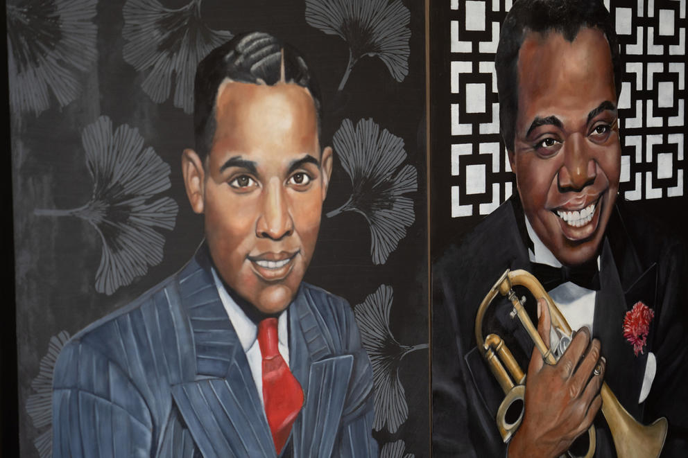 two oil paintings side by side, at left a Black man in a pinstripe suit, at right a Black man holding a trumpet