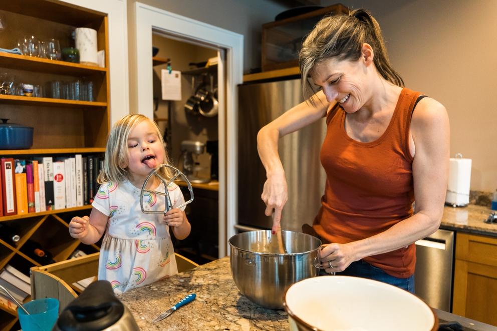 3-year-old helps her mom make cookies