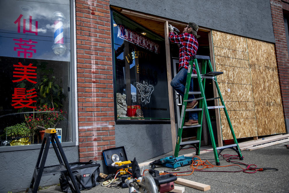 boarding up windows on a businesses 