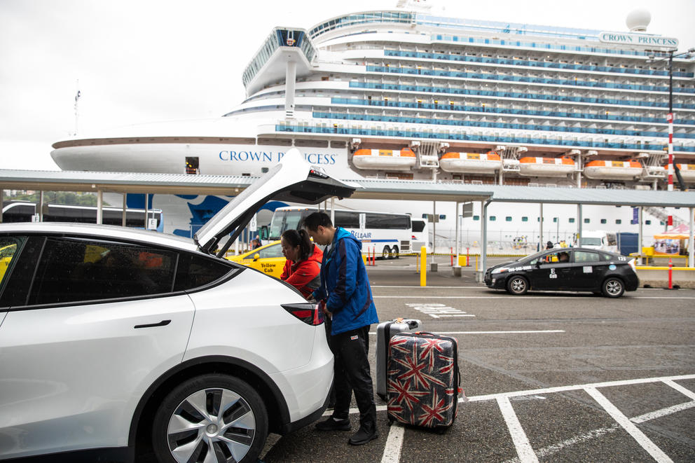 Cruise ship passengers pack up their luggage after disembarking