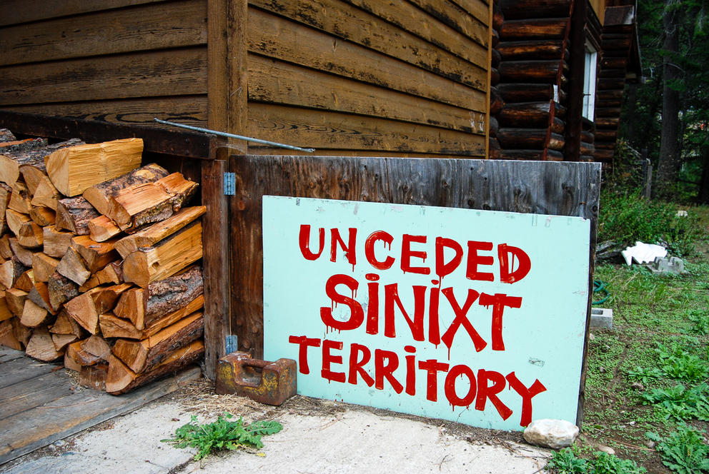 A sign outside the Big House coffee shop in Slocan, Canada, says 'Unceded Sininxt Territory.'