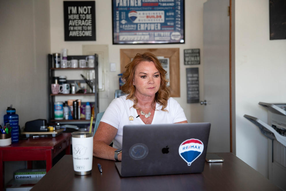 Real estate broker Kitty Wallace works in her Cle Elum office 