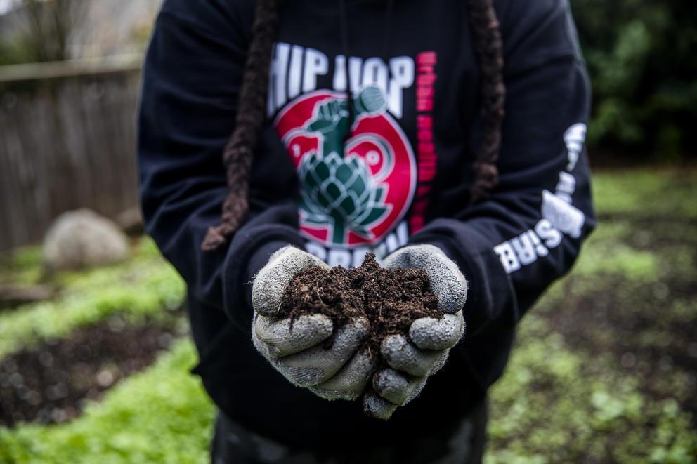 Hands holding soil for farming 