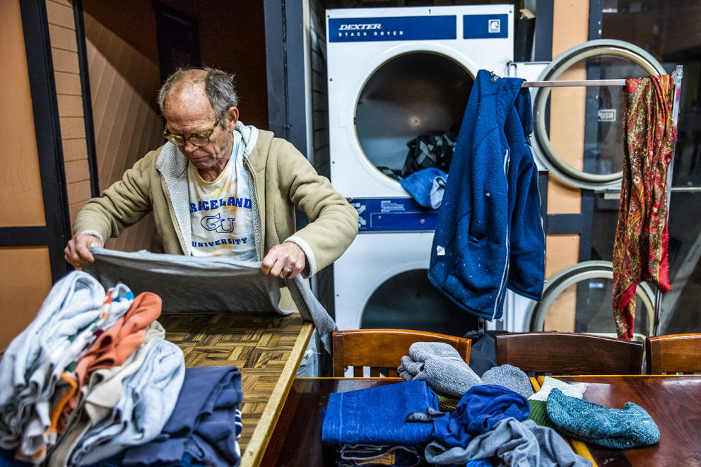 Alan Sutherland, 64, of Seattle does his laundry at King Donuts in Rainier Beach on Sunday, Nov. 18, 2018. Sutherland says he comes every Sunday to do his laundry at King Donuts.
